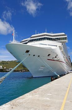 Cruise ship docked at a port in the Caribbean Sea.