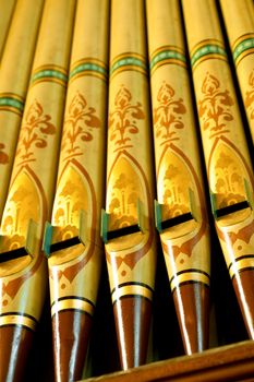 colorful old church organ pipes made of wood