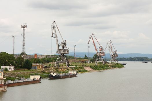 Industrial dock with cranes on the quay