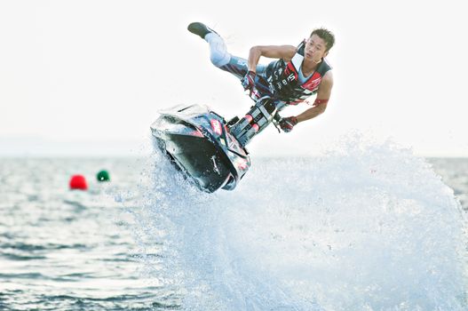 PATTAYA - DECEMBER 7: Haruki Tsukamoto from Japan competing during the freestyle competition of Thai Airway International Jet Ski World Cup at Jomtien Beach, Pattaya, Thailand on December 7, 2014.