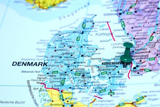Photo of pinned Copenhagen on a map of europe. May be used as illustration for traveling theme.