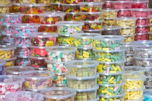 Tubs of sweets at a market stall