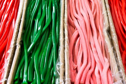 Green and red candy laces at a market