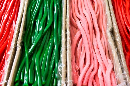 Green and red candy laces at a market