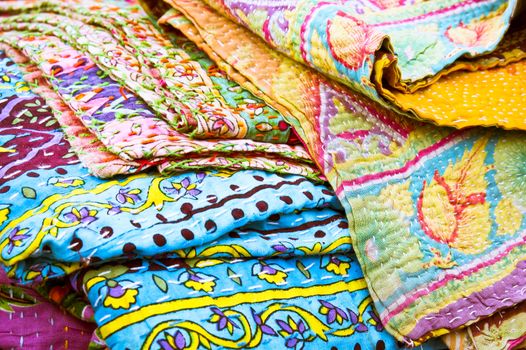 Sheets of colorful patterned cloth at a market