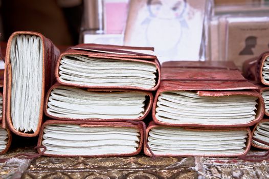 Old fashioned leather notebooks on sale at a market