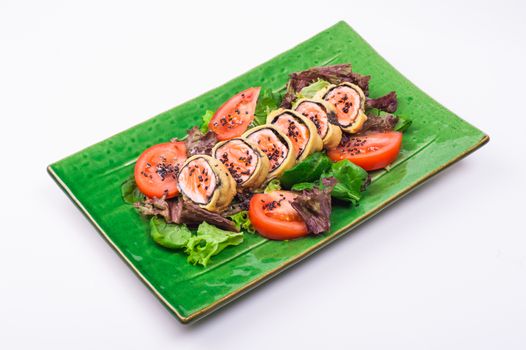 fried salmon roll on plate isolated on white background 