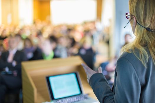 Female speaker at Business Conference and Presentation. Audience at the conference hall. Business and Entrepreneurship. Business woman.