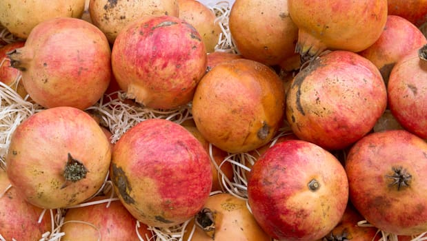 Freshly harvested pomegranates at a market