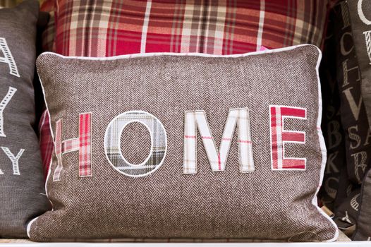 Cushion with home written on it