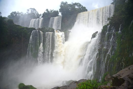 Iguassu waterfall in south america tropical jungle with a massive flow of water