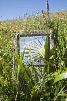 ceramic signal with public Middle Ages symbol of Camino de Santiago the biggest Christian pilgrimage route this in Asturias Spain Europe