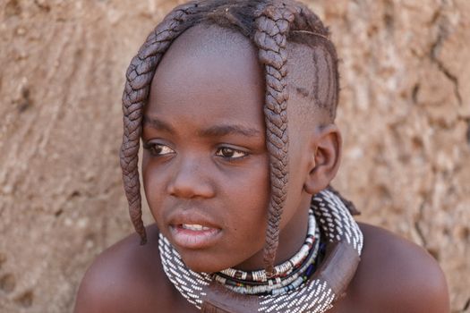 NAMIBIA, KAMANJAB, OCTOBER 10: Unidentified child Himba tribe. The Himba are indigenous peoples living in northern Namibia, in the Kunene region of South-West Africa on october 10 2014