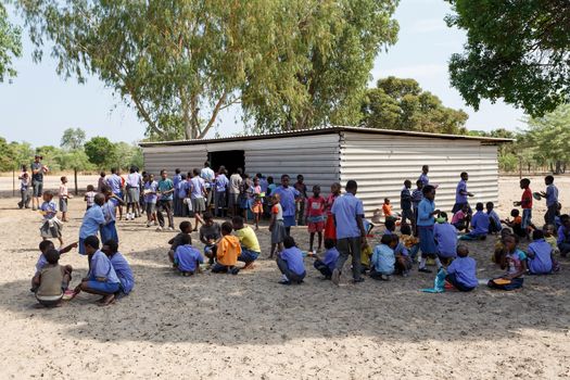 NAMIBIA, KAVANGO, OCTOBER 15: Happy Namibian school children waiting for a lesson. Kavango was the region with the highest poverty level in Namibia, more than 50% of the population were classified as poor. October 15, 2014, Namibia