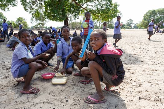 NAMIBIA, KAVANGO, OCTOBER 15: Happy Namibian school children waiting for a lesson. Kavango was the region with the highest poverty level in Namibia, more than 50% of the population were classified as poor. October 15, 2014, Namibia
