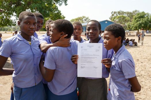 NAMIBIA, KAVANGO, OCTOBER 15: Happy Namibian school children waiting for a lesson. Kavango was the region with the highest poverty level in Namibia, more than 50% of the population were classified as poor. October 15, 2014, Namibia