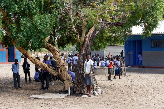 NAMIBIA, KAVANGO, OCTOBER 15: Happy Namibian school children waiting for a lesson. Kavango was the region with the highest poverty level in Namibia, more than 50% of the population were classified as poor. October 15, 2014, Namibia