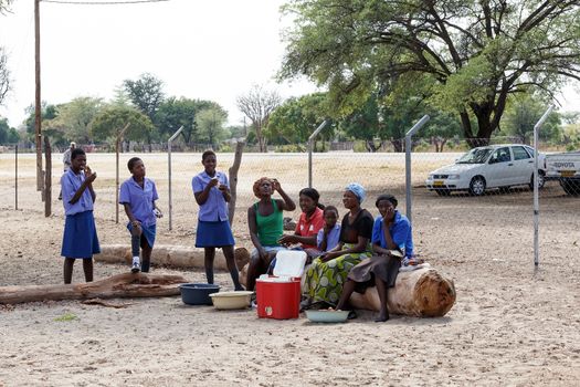 NAMIBIA, KAVANGO, OCTOBER 15: Happy Namibian school children waiting for a lesson. Kavango was the region with the highest poverty level in Namibia, more than 50% of the population were classified as poor. October 15, 2014, Namibia