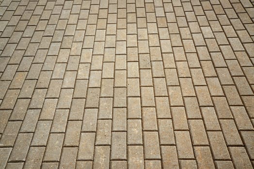 Photo of a stone road from cement blocks. May be used as a background. Taken in Riga, Latvia.