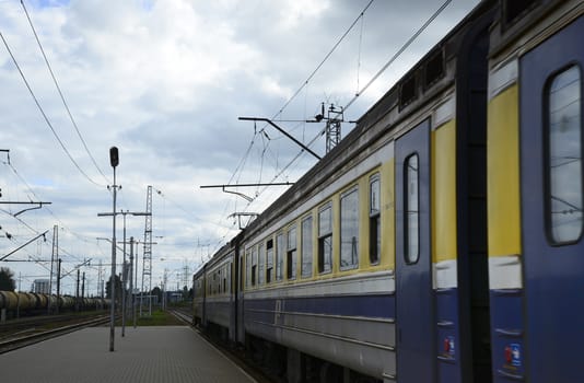 Photo of a train departing from a railway platform. Taken in Riga, Latvia.