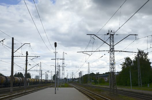 Photo of a railway station platform with electricity transmission system. Taken in Riga, Latvia.