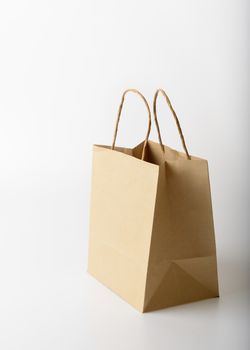 brown paper shopping bag on white background