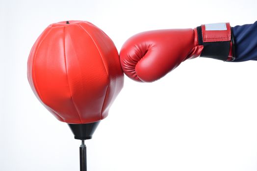 red boxing glove punch a red punching bag exercises isolated in white