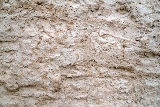 Photo of a messy cement wall. May be used for texture and background.
