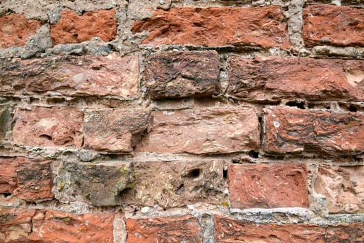 Photo of a red brick wall. May be used for texture and background.