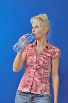 Blond woman drinking water