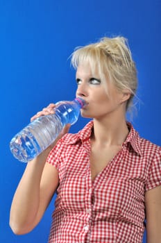 Blond woman drinking water