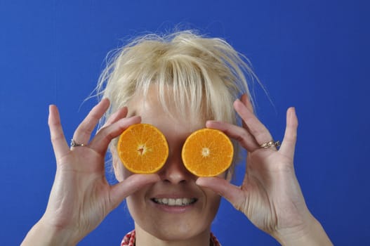 Portrait of womanwith a clementine