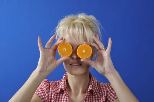 Portrait of womanwith a clementine