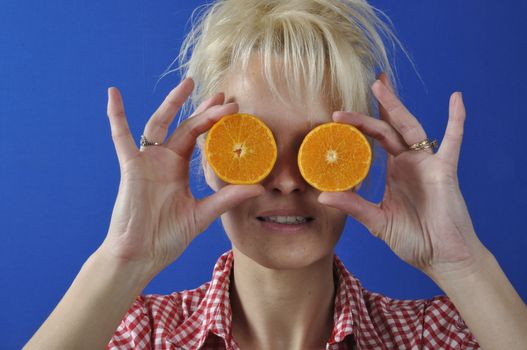 Portrait of womanwith a clementine