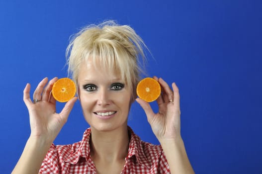 Portrait of womanwith a clementine