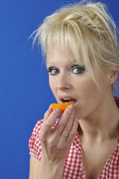 Portrait of womanwith a clementine