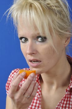 Portrait of womanwith a clementine