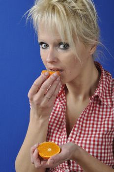 Portrait of womanwith a clementine