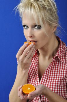 Portrait of womanwith a clementine