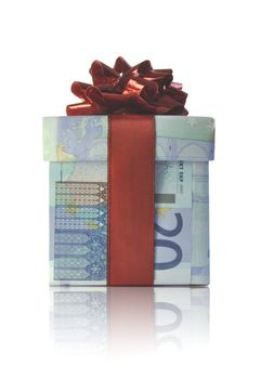 Gift box wrapped with euro banknotes with a red ribbon 