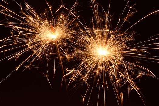 Photo of burning christmas sparklers. Object photography.