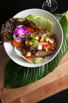 Traditional dish of freshly prepared Thai food.  Thai seafood and som tum green papaya salad.