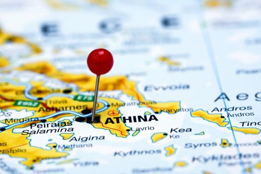 Photo of pinned Athens on a map of europe. May be used as illustration for traveling theme.