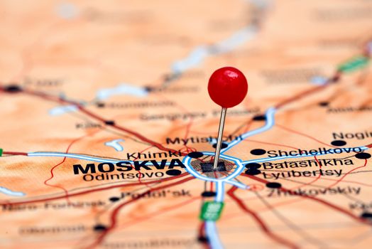 Photo of pinned Moscow on a map of europe. May be used as illustration for traveling theme.