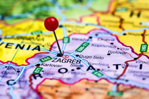 Photo of pinned Zagreb on a map of europe. May be used as illustration for traveling theme.