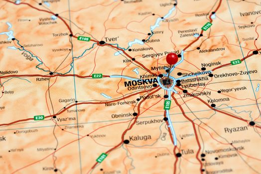 Photo of pinned Moscow on a map of europe. May be used as illustration for traveling theme.