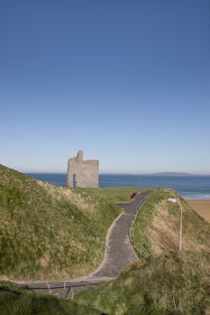 a beautiful path with benches with views of Ballybunion beach and castle