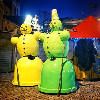 Street waste bin decorated as christmas snowman