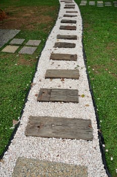 stone and wood pathway in the garden park