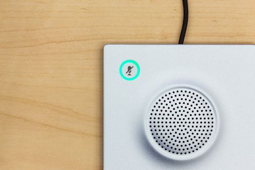 Microphone icon switch, and loudspeaker on wood background for conferencing room